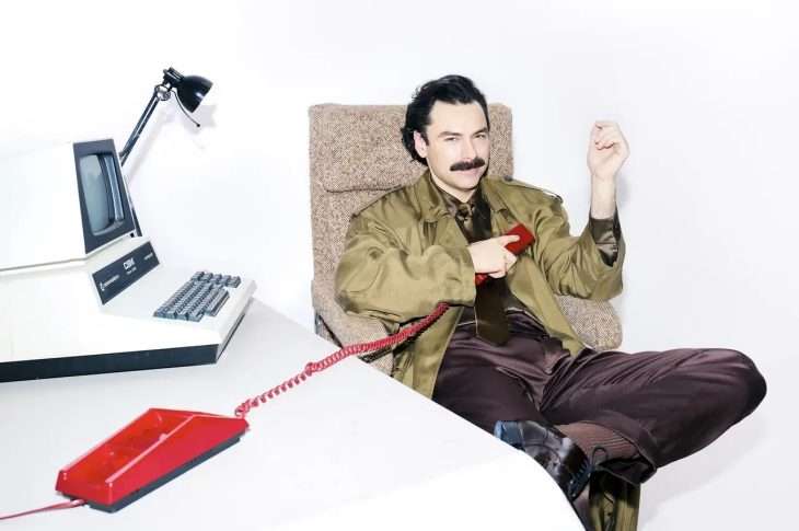 Aidan Turner at desk for The Observer Photoshoot